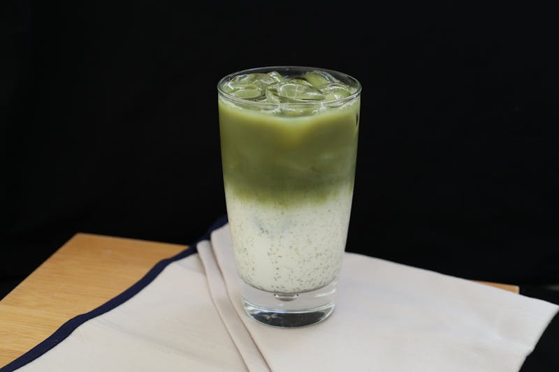 Iced honey matcha green tea drink with oat milk